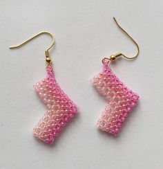 beaded earrings pink beaded earrings ombre pink colours pale to bubblegum chevron shaped arrow shaped unusual girly pink  A pair of beaded earrings in pink. These beaded earrings have an ombre colour change to them, the pink colours change from  pale to bubblegum pink throughout the chevron shaped earrings.  Or they could be direction arrow shaped. You decide! Either way they are unusual and very girly pink Cute Pink Beaded Dangle Earrings, Cute Pink Dangle Beaded Earrings, Handmade Cute Pink Beaded Earrings, Cute Handmade Pink Beaded Earrings, Cute Pink Handmade Beaded Earrings, Cute Pink Beaded Earrings For Gift, Direction Arrow, Pink Beaded Earrings, Ombre Colour