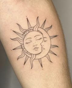 a sun and moon tattoo on the arm