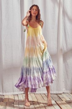 The Empire State of Love Tiered Maxi Dress will be sure to garnish you lots of compliments since it is simply stunning. Comfy and sleek, feel free to lounge around in this beauty or take her out for a stroll, her soft rainbow colors will be on point no matter where you wear her. Featuring rainbow tie-dye colors, It shows a scoop front and back, is tiered all the way down with flowy ruffles at the bottom and adjustable ties at the top with tassels. 100% Rayon Size S: Length measures 49.5” from sh Mode Batik, Color Block Maxi Dress, Pastel Tie Dye, Tie Dye Outfits, Tie Dye Colors, Rainbow Tie, Tie Dye Maxi Dresses, Tie Dye Maxi, Rainbow Dress