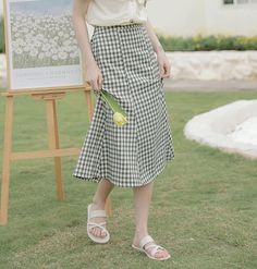 Midi length skirt with an elastic back. Hugs your hips and flares at the hem. Lined. 23.5"-31.5" waist, 37" hips, 28" length Casual Maxi Skirt With Pleated Hem, Casual Fitted Skirt With Flared Hem, Fitted Casual Maxi Skirt With Pleated Hem, Summer Pleated Long Skirt, Spring Knee-length Ruffled Skirt, Spring Fitted Skirt With Flared Hem, Spring Workwear Bottoms With Flared Hem, Spring Workwear Skirted Bottoms, Summer Workwear Gathered Skirt