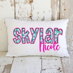 a white pillow with the word skylarr above it