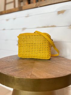 The yellow rattan rectangular midi sac handbag by Clare V Designer Rectangular Shoulder Bag For Spring, Luxury Rectangular Shoulder Bag For Spring, Rectangular Leather Clutch For Shopping, Gold Woven Leather Shoulder Bag, Elegant Yellow Leather Box Bag, Luxury Yellow Rectangular Box Bag, Spring Woven Leather Shoulder Bag, Spring Leather Shoulder Bag With Woven Details, Evening Woven Leather Rectangular Bag