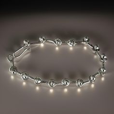 Discover the elegance of this handmade 925 sterling silver ball-link bracelet. Featuring a unique and stylish design, each link is crafted into a smooth, polished ball that creates a sophisticated yet contemporary look. This bracelet is perfect for any occasion, whether you're dressing up for a special event or adding a touch of elegance to your everyday wear. Its sleek design ensures versatility and timeless appeal. This sterling silver ball-link bracelet makes an ideal gift for someone special Elegant Sterling Silver Ball Chain Bracelets, Elegant Sterling Silver Ball Chain Bracelet, Elegant Silver Bracelet With Ball Chain, Elegant Silver Ball Chain Bracelet, Silver Ball Chain Bracelet, Elegant Sterling Silver Bracelet With Polished Beads, Wrist Game, Silver Accessories, Bracelet Handmade