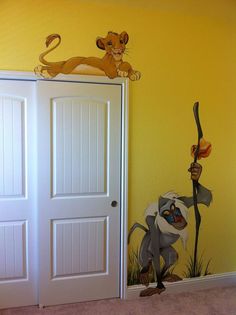 the lion king mural is painted on the wall in this child's nursery room