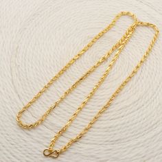 Please click -- Learn more about this item -- below for a full description 22k gold chain necklace handmade jewelry made in India Total length of the product is 24.5 inches and 3 millimeter width approx. weight is 20.69 grams approx. 22k Gold Chain Necklace, Antique Hallmarked Gold Chain Necklace, 22k Yellow Gold Link Chain Necklace, Gold-tone 14k Gold Jubilee Chain Bracelet, Rodium Polish Gold Chain Indian, Gold-tone Brass Chain Necklace With Adjustable Chain, 22k Gold Chain, Gold Link Chain, Gold Link