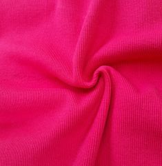 a close up view of a bright pink fabric