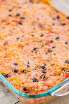 a casserole dish with black beans and cheese in it on a wooden table