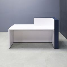 a white and blue bench sitting in front of a gray wall