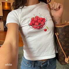 🍒 Step into the Y2K revival with this ultra-cute coquette cherry graphic tee! The perfect blend of nostalgic and trendy, this shirt features a vibrant bowl of cherries that'll add a playful touch to your wardrobe. Made with soft cotton for all-day comfort, this shirt is ideal for those who love a vintage aesthetic with a modern twist. Whether you're out for a casual meet-up or just lounging at home, this unisex top is sure to become a staple in your collection. 🎀  Looking for a graphic baby te Coquette Cherry, Cherry Graphic, Coquette Top, Coquette Shirt, Cute Coquette, Shirt Coquette, Cherry Baby, Softgirl Aesthetic, Shirt Y2k