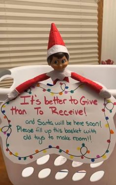 an elf is sitting on top of a basket with a sign that says, it's better to give than to receive and santa will be here soon