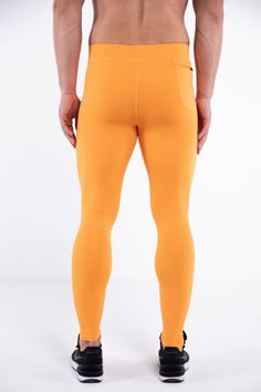 Description: Orange Men’s Workout Leggings Compression Level: Medium to High Bounce-Proof Phone Pocket Zip Pocket For Cash & Keys Sweat-wicking Poly / Spandex with 4-Way Stretch Ergonomic Waistband Adjustable Drawstring Reinforced Stitching & Flat Seams Embroidered Bolt Logo Machine Wash Cold, Quick Drying Model is 6’2’’ (189cm) tall, 34’’ (86cm) waist size and wears size Large. Sporty Orange Breathable Bottoms, Snug Fit Moisture-wicking Sportswear Bottoms, Breathable Orange Sports Bottoms, Orange Breathable Sports Bottoms, Athleisure Orange Training Bottoms, Orange Athleisure Bottoms For Training, Breathable Orange Workout Bottoms, Functional Solid Snug Fit Bottoms, Outdoor Athleisure Activewear In Elastane