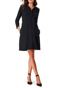 Saunter from the office to your next cocktail party in this versatile and stretchy minidress equipped with side pockets for on-the-go convenience. 35" length Slips on over head Ruffled half placket Three-quarter sleeves Side-seam pockets Unlined 72% cotton, 23% polyester, 5% spandex Machine wash, tumble dry Imported Elegant Mini Shirt Dress With Pockets, Stretch Mini Dress For Office, Chic Mini Dress For Work With Flattering Silhouette, Chic Mini Dress With Flattering Silhouette For Work, Chic Mini Dress For Work, Elegant Fitted Shirt Dress With Pockets, Chic Stretch Mini Dress For Work, Formal Black Dresses With Pockets, Black Formal Dress With Pockets