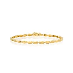 The Small Dome Tennis Bracelet is crafted in polished 18 karat gold and exudes timeless, vintage inspired appeal to create a sophisticated wear-forever look. Whether worn alone, or stacked with other bracelets, this tennis bracelet instantly elevates any look. It's the perfect foundation for your jewelry wardrobe - instantly adding a dose of quiet luxury with minimalist elegance. Bracelet measures 6.5 inches in length Push Clasp Fastening with Safety Made with love in Los Angeles Complimentary g Classic White Gold Diamond Bracelet With Oyster Clasp, Classic White Gold Diamond Oyster Bracelet, Classic Diamond Bracelet With Polished Finish For Formal Occasions, Classic Polished Diamond Bracelet For Formal Occasions, Timeless Polished Tennis Bracelet For Formal Occasions, Luxury 14k Gold Flexible Tennis Bracelet, Timeless Flexible Yellow Gold Bracelet, Classic Everyday Luxury Flexible Jewelry, Flexible 14k Gold Timeless Bracelets