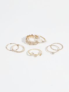 This ring set is a jewelry staple! Add these adorable dainty rings to any of your favorite looks to elevate your style! With all this shine, you can't go wrong! Trendy Stackable Promise Ring Jewelry, Trendy Wedding Midi Rings, Trendy Stackable Ring, Rings Cheap, Gold Bracelets Stacked, Vine Ring, Dainty Rings, Jewelry Staples, Accesories Jewelry