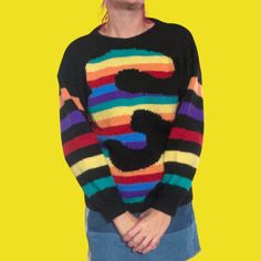 Wild 80s hand knit jumper/sweater in THE BEST abstract rainbow swirl on black. This one is an absolute cracker. NO ONE else will be wearing this knit! Well made and super comfy. Excellent vintage condition with minimal signs of wear. Best fit size 8-12 modern Australian women's sizing. MEASUREMENTS TAKEN FLAT: Shoulder to shoulder: 59cm Bust: 53cm Sleeve length: 50cm Overall Length: 62cm Waistband across: 38cm (unstretched) This unique vintage piece has been washed, steamed and detailed. Sorry, Spiral Sweater, Playful Multicolor Winter Sweater, Rainbow Turtleneck Sweater, Oversized Multicolor Retro Sweater, Oversized Multicolor Vintage Sweater, Multicolor Graphic Print Knit Sweater, Hand Knitted Jumpers, Rainbow Swirl, Rainbow Abstract