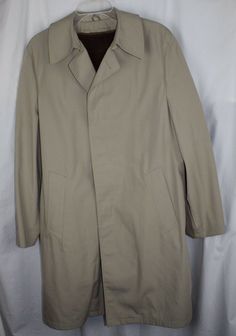 Vintage The Men's Store by Sears Coat This piece is so versatile, you are going to love it! 100% authentic guaranteed!    Size: 40 regular Khaki Zip in/out warm lining Concealed button closure About 40" long Classic Mod look Just dry cleaned (see photo) Clean and nice condition Coming from our 100% smoke free and pet free facility  Returns: This may be returned within 30 days for a refund. The item must arrive in unused condition.  Dream-Adventures is a 100% smoke free environment. We are commit Mod Look, Men's Trench Coat, Trench Coat Dress, Nostalgia Core, Jersey Boys, Men Store, Dress Jacket, Photo Size, Coat Dress