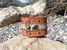 recycled leather belt cuff, leather cuff, leather bracelet, upcycled leather cuff, studded cuff, wom Vintage Leather Bracelet With Rivets, Leather Cuff Bracelet With Rivets, Rustic Cuff Bracelet For Festivals, Vintage Leather Cuff Bracelet For Festival, Leather Concho Cuff Bracelet, Leather Cuff Bracelet With Concho, Upcycled Leather, Cuff Jewelry, Leather Cuffs Bracelet