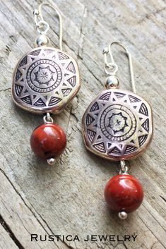 Silver dangle earrings with southwestern pattern and a red jasper dangle. #SilverEarrings #SilverJewelry #RedEarrings #SouthwesternEarrings #RedJewelry #SilverDangleEarrings #SilverDropEarrings #Giftsforher #Giftsforwomen #Jewelrygiftideasunder30 Concho Dangle Earrings For Gift, Bohemian Jasper Dangle Jewelry, Artisan Red Dangle Earrings, Red Bohemian Sterling Silver Earrings, Nickel-free Southwestern Red Earrings, Nickel-free Red Southwestern Earrings, Red Southwestern Dangle Earrings, Southwestern Red Dangle Earrings, Southwestern Style Red Dangle Earrings