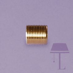 an image of a table lamp that is on the floor and it has gold colored metal parts