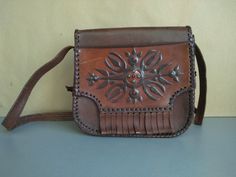 Vintage Bag Of Genuine Calfskin - Retro leather bag - Old leather bag from 70' - brown leather bag - Genuine Leather Bag - Shoulder bag Dimensions : Height without the handle - 21 cm 21 cm x 23 cm x 8 cm For other vintage bag check here : https://www.etsy.com/shop/TheVINTAGEShopBG?ref=l2-shop-info-name&section_id=22456024 All pictures are real . You buy exactly what you see in the photos . Thank you for visiting my store. Please check out my other items 😊 Vintage Brown Soft Leather Rectangular Bag, Vintage Brown Rectangular Bag With Removable Pouch, Medium Leather Shoulder Bag With Removable Pouch, Medium Brown Shoulder Bag, Vintage Brown Briefcase With Removable Pouch, Brown Medium Satchel With Removable Pouch, Medium Brown Satchel With Removable Pouch, Brown Medium Shoulder Bag, Vintage Leather Briefcase With Removable Pouch