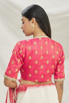 Pink saree blouse with sequin work embroidered motifs on the base of dupion fabric.
Component: 1
Pattern: Embroidered
Type Of Work: Sequin work
Neckline: V-neck
Sleeve Type: Half sleeves
Fabric: Dupion
Color: Pink
Other Details: 
Embroidered motifs
Note: The saree worn by the model is not for sale.
Occasion: Puja - Aza Fashions Silk Embroidered Fabric For Unstitched Blouse, Reception, Fitted Tops For Reception During Diwali, Festive Raw Silk Blouse With Traditional Drape, Saree Blouse With Resham Embroidery For Reception, Festive Blouse With Resham Embroidery For Reception, Festive Resham Embroidery Blouse For Reception, Festive Zari Work Blouse For Reception, Pink Chanderi Blouse For Reception, Bollywood Style Embroidered Raw Silk Fabric