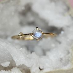 Every hero needs a sidekick...With our "Sidekick" ring in 14K gold, you can feel super all the time! Center moonstone is accented on one side by a tiny diamond. Super cute! - 4mm smooth moonstone - 1.3mm diamond - 1.3mm round band - Available in solid 10K or 14K gold For our amethyst "Sidekick" ring click here: https://www.etsy.com/listing/580095152/14k-amethyst-diamond-ring-sidekick-ring?ref=shop_home_active_23 Processing times -  Current processing time is 1 - 3 weeks. Each Item is handmade to Asymmetrical Ring, Moonstone Rings, Pretty Engagement Rings, Ring Inspo, Ring Moonstone, Amethyst And Diamond Ring, Zierlicher Ring, Cabochon Ring, Tiny Diamond