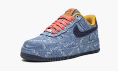 The Levi's x Nike Air Force 1 Low takes two iconic brands and merges them to create an undeniably popular silhouette.  The low-top sneaker is appropriately dressed in indigo denim and accented with red laces, a dark blue Swoosh, and yellow collar.  A brown leather tongue tag adds a premium touch, while lasered co-branding in white covers the entirety of the upper, and a red Levi's tab is stitched on the right heel.  The Air Force 1 Low was released in August 2019 with a limited-edition capsule c Indigo Denim, Nike Air Force 1 Low, Air Jordan 1 Low, Denim Shoes, Levis Denim, Air Force 1 Low, Jordan 1 Retro High, Jordan 1 Retro, Dream Shoes