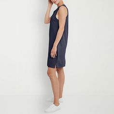 Basics that are far from basic. This Hanes original tank dress is cute, sporty, and just the look for a casual day on the town. It's made from cotton with vintage-inspired garment dye for a retro look you'll love. The loose fit makes it a comfortable go-to you can dress up or down. Rock it with your best jacket or with fresh white sneakers. Bound collar and armholes add structure, while the small slits on the hem increase mobility. Hits at the knee making it the perfect length and our best cotto Sporty Sleeveless Loungewear Dresses, Sporty Sleeveless Lounge Dresses, Athleisure Sleeveless Loungewear Dress, Casual Knee-length Tank Top, Spring Cotton Athleisure Dress, Blue Athleisure Summer Dress, Casual Sleeveless Dress For Everyday, Casual Sleeveless Everyday Dress, Increase Mobility