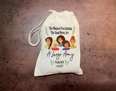 a drawstring bag with the words, the women proclaiming the good work is