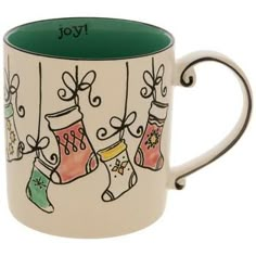 a coffee mug with stockings and stockings hanging from it's sides, on a white background