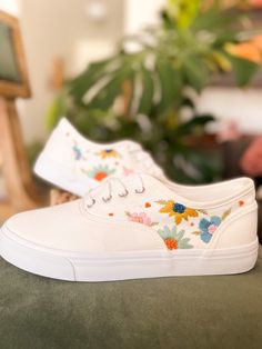 Cute white canvas sneakers with hand embroidery floral design! Made to order White Canvas Shoes Painting, Painting White Sneakers, Hand Embroidered Sneakers, White Shoe Designs Diy, Embroidery Designs Shoes, Shoes Embroidery Design, Embroidery On Sneakers, Hand Embroidery On Shoes, Spring Canvas Shoes With White Laces And Round Toe