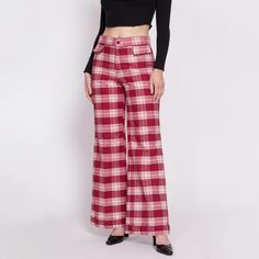 Vintage early 70s red & white plaid pants with a high waist, faux pockets, and a cuffed wide leg. Should work for men or women, see details below. Measurements and Condition: Fits like: Men's small, women's medium Fabric: Feels like poly/rayon Brand: None Condition: Very good/as is, with faint pink color bleed throughout the white parts (most prominent on the waistband and down the front rise - see close up). Still very wearable as is because it is fairly uniform. Waist: 31" Hips: 38" - taken at Retro Wide Leg Bottoms For Fall, Plaid Wide-leg Cotton Pants, Plaid Cotton Wide-leg Pants, Retro Red Bottoms For Fall, Spring Plaid Wide Leg Pants, Wide-leg Plaid Bottoms With Pockets, Plaid Wide-leg Pants With Pockets, High Waist Plaid Cotton Bottoms, Retro Plaid Bottoms For Spring