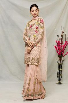 Peach kurta with embroidery jaal pattern and highlighted in sequins. Paired with gharara and dupatta.
Components:3
Pattern:Embroidered
Type of Work:Floral, jaal
Neckline:Round
Sleeve Length:Full sleeves
Fabric:Georgette, net, shantoon
Color:Peach
Other Details:
Pleated gharara
Sheer dupatta
Occasion:Sangeet - Aza Fashions Sheer Dupatta, Designer Punjabi Suits, Designer Gowns, Full Sleeves, Kids Sleepwear, Set For Women, Festival Wear, Aza Fashion, Full Sleeve