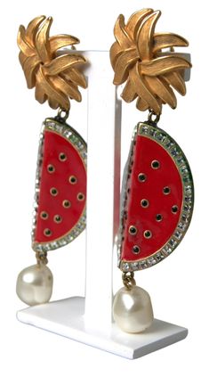 DOLCE & GABBANA Gorgeous brand new, 100% Authentic Dolce & Gabbana Gold-tone plated brass. Watermelon enamel pendant. Simulated pearl accent. Crystal trim. Clip-on backing. Model: Clip on Dangling Motive: Watermelon Material: Brass, Crystal and enamel Color: Red Crystals: Clear and Black Logo details Made in Italy Dolce And Gabbana Earrings, Red Watermelon, Affirmation Jewelry, Poncho Pullover, Watermelon Designs, Radiant Red, Crystal Trim, Italian Craftsmanship, Gold Clips