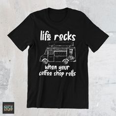 a black t - shirt with the words life rocks when your coffee shop rolls on it