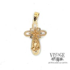 This exquisite 10 karat yellow gold cross pendant features a delicate lace design and embossed praying hands with one tiny diamond in center. 10 karat yellow gold lace design cross pendant with embossed praying hands Chain sold separately 14k Gold Cross Necklace For First Communion, 14k Gold Cross Pendant Spiritual Jewelry, Spiritual 14k Gold Cross Pendant, Yellow Gold Cross Pendant For First Communion, Yellow Gold Cross Pendant For Baptism, Gold Cross Pendant Jewelry For Baptism, Yellow Gold Baptism Cross Pendant Jewelry, Gold Cross Jewelry For Baptism, 14k Yellow Gold Crucifix Jewelry