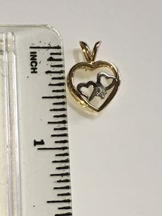 Beautifully vintage. Solid 14K Two Tone Gold Heart Charm Pendant. Stamped 14K and the designer's mark. Yellow Gold Heart with Double White Gold Hearts and a small, genuine, round cut Diamond. Can represent...Love, family, children, union, twins, siblings. Perfect for a necklace. Gold Heart Necklace Hallmarked For Anniversary, Gold Hallmarked Heart Necklace For Anniversary, Gold Heart Necklace With Hallmark For Anniversary, Gold Double Heart Necklace Stamped 14k, Vintage Double Heart 14k Gold Jewelry, Vintage 14k Gold Double Heart Jewelry, Double Heart 14k Stamped Anniversary Necklace, 14k Stamped Double Heart Necklace For Anniversary, Double Heart 14k Stamped Necklace For Anniversary