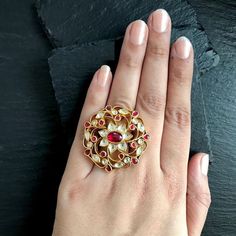 *It's One of a kind Antique Statement Kundan Wedding Ring.Gold Plated Handmade Kundan Jewelry for Indian and Pakistani Brides. *It's made from Silver and Copper with White and Pink Kundan Stones Settings & 22k gold Plating as shown in picture. *It's beautiful Ethnic 2 Inch Round Unique Bridal Ring. *It's Adjustable and fit for all size. *Our all jewelry is made from semiprecious stones and beads. *WARRANTY: ITS GENUINE HANDMADE JEWELRY AND WE ARE GIVING LONG LIFE WARRANTY FOR OUR ALL ITEMS. All Kundan Jadau Ring, Rajasthani Jewellery Royal, Polki Rings Design, South Indian Wedding Jewelry, Polki Rings, Kundan Rings, Moti Set, Victorian Rings Vintage, Vintage Bridal Ring