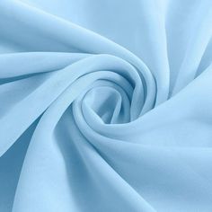 a close up shot of a light blue fabric