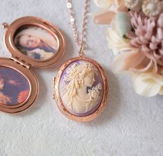 This is a vintage inspired oval locket necklace in beautiful rose gold finish. The oval locket is has lovely lace scalloped details. The center focal cameo is a highly detailed ivory cream lady face profile on a beautiful lavender colored background. The locket is suspended from a rose gold plated brass chain with lobster clasp closure. Measurement: Locket: approx. 1.9'' x 1.4'' (48mm x 35mm) Cameo: 40mm x 30mm PERSONALISATION We can personalize this locket by adding 1 or 2 photos for you. You c Oval Cameo Necklace Keepsake, Oval Cameo Necklace For Keepsake, Vintage Rose Gold Oval Locket Necklace, Oval Locket Necklace, Lady Face, Face Profile, Oval Locket, Gold Locket, Colored Background