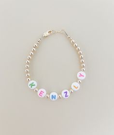 4mm gold-filled beads with assorted colored letter beads, this bracelet is great for a gift or a customized piece! The colored letter beads add a unique touch. I use the highest quality beads and is hand made to order for your special someone. It makes great personalized and custom gifts for Mom.  Mama Jewelry Mama gifts Custom adult jewelry Gold bracelets beaded bracelets  Hand made in the U.S.A. *see bottom of Etsy page for sizing details* Thanks for shopping small! *measure wrist for most acc Personalized Round Beads Name Bracelet For Birthday, Personalized Name Bracelet With Round Beads For Birthday, Hypoallergenic Name Bracelet With Round Beads For Birthday, Hypoallergenic Name Bracelet For Birthday, Multicolor Hypoallergenic Name Bracelet With Round Beads, Personalized Multicolor Name Bracelet For Everyday, Customized Silver Name Bracelet With Round Beads, Hypoallergenic Multicolor Name Bracelet With Round Beads, Playful Customizable Name Bracelet With Round Beads