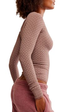 A knit-to-fit top is textured in a tonal print and bares a bit of belly to add some sass. 21" length (size Medium) Scoop neck Long sleeves 64% nylon, 28% polyester, 8% spandex Machine wash, dry flat Imported Cheap Pointelle Knit V-neck Tops, Textured Tops For Fall, Textured Crew Neck Top For Layering, Brown Jacquard Knit Crew Neck Top, Fitted Loungewear Tops With Thumbholes, Snug Fit Long Sleeve Ribbed Tops, Snug Fit Ribbed Long Sleeve Tops, Fitted Tops With Thumbholes For Loungewear, Fitted Jacquard Knit Tops For Spring