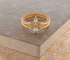 a gold ring sitting on top of a table