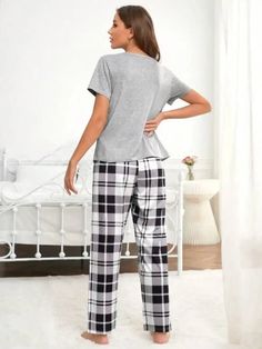 Discover ultimate comfort with our Graphic Tee And Plaid Print Pants Pajama Set. Embrace style effortlessly with plaid and slogan patterns. Designed for relaxation, this pant set offers a loose-fit pajama and short-sleeved tee. Crafted from a fabric with a slight stretch, it ensures unrestricted movement. Enrich your loungewear collection with this blend of style and ease. Features: Pattern Type: Plaid, Slogan Type: Pant Sets Neckline: Round Neck Sleeve Length: Short Sleeve Fit Type: Loose Shee Plaid Cotton Loungewear Sets, Plaid Cotton Sleepwear Sets, Cotton Plaid Sleepwear For Loungewear, Comfortable Plaid Cotton Sleepwear, Plaid Cotton Sleepwear For Loungewear, Plaid Cotton Sleep Sets, Plaid Relaxed Fit Sleepwear For Loungewear, Casual Plaid Cotton Sleepwear, Cotton Plaid Sleepwear For Lounging