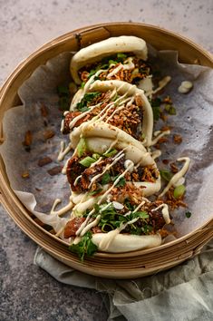 a wooden bowl filled with food on top of a table