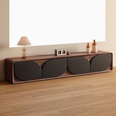 an entertainment center with two speakers and a lamp