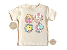 Level up your little one's style with our Super Mario Kids Shirt! Featuring iconic characters from the beloved Super Mario series, including Mario, Luigi, Princess Peach, and more. Crafted with high-quality, soft fabric for all-day comfort during playtime adventures. Perfect for young gamers and fans of the timeless Super Mario franchise. Available in a range of sizes to fit kids of all ages. Whether they're jumping over obstacles or collecting coins, this shirt is sure to spark their imaginatio Themed Short Sleeve Tops For Playtime, Cute Character Print Shirt For Playtime, Cute Shirt With Character Print For Playtime, Playful Unisex Tops With Character Print, Playful Character Print Tops, Super Mario Birthday Shirt, Peach Girl, Mario Shirt, Super Mario Princess