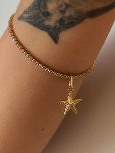 This 14k solid gold charm is made of 0,55 gr high quality gold.  You can wear this starfish charm for all chains, add it on your bracelets or bangles.  You can wear it on your necklaces as a sea star pendant You can wear this all purpose charm on your anklets as a sea star anklet charm. You will love this add on charm to hoop earrings. Add on your hoops as a hoop charm.  You can also wear as bracelet charm.  We produce this multifunctional starfish  charm in yellow gold, white gold or rose gold. Gold Starfish Bracelet With Starfish Charm, Gold Starfish Charm Jewelry, Gold Star-shaped Jewelry With Dangling Charms, Star Anklet, Trendy Jewellery, Solid Gold Charms, Gold Certificate, Hoop Charms, Sea Star