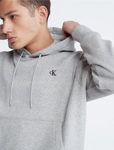 Made from a soft cotton blend, this fleece hoodie offers ultimate comfort for everyday wear. Designed with long sleeves and a kangaroo pocket at the front. Finished with CK monogram logo embroidery at the upper chest.  Material: 80% Cotton, 20% Polyester. Ck Monogram, Archive Logo, Drawstring Hoodie, Monogram Logo, Logo Embroidery, Embroidery Logo, Fleece Hoodie, Kangaroo Pocket, Kangaroo