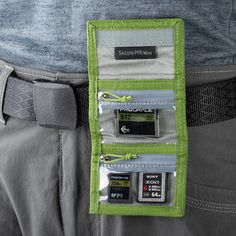 The highland green Mini Secure Pixel Pocket Rocket Memory Card Wallet from Think Tank Photo holds 4 CF or CFexpress cards, 6 SD cards, or multiple microSD cards. Its folding design features a secure hook-and-loop closure and clear zippered pockets for easy card identification and security. Sized to fit in your pocket or bag, it includes a removable security lanyard and belt attachment for convenient transport. Made from durable, weather-treated double-ripstop material, this wallet protects your cards from the elements. Pocket Rocket, Safe Storage, Think Tank, Memory Card, Micro Sd, Simple Cards, Sd Card, Card Wallet, Lanyard